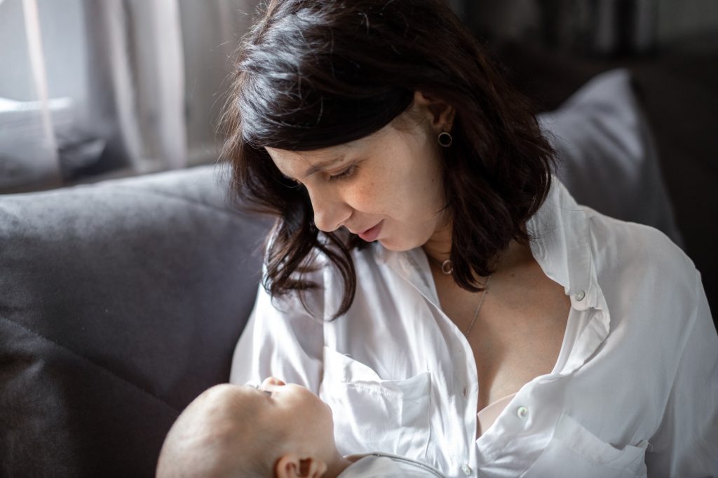 mom breastfeeds the baby