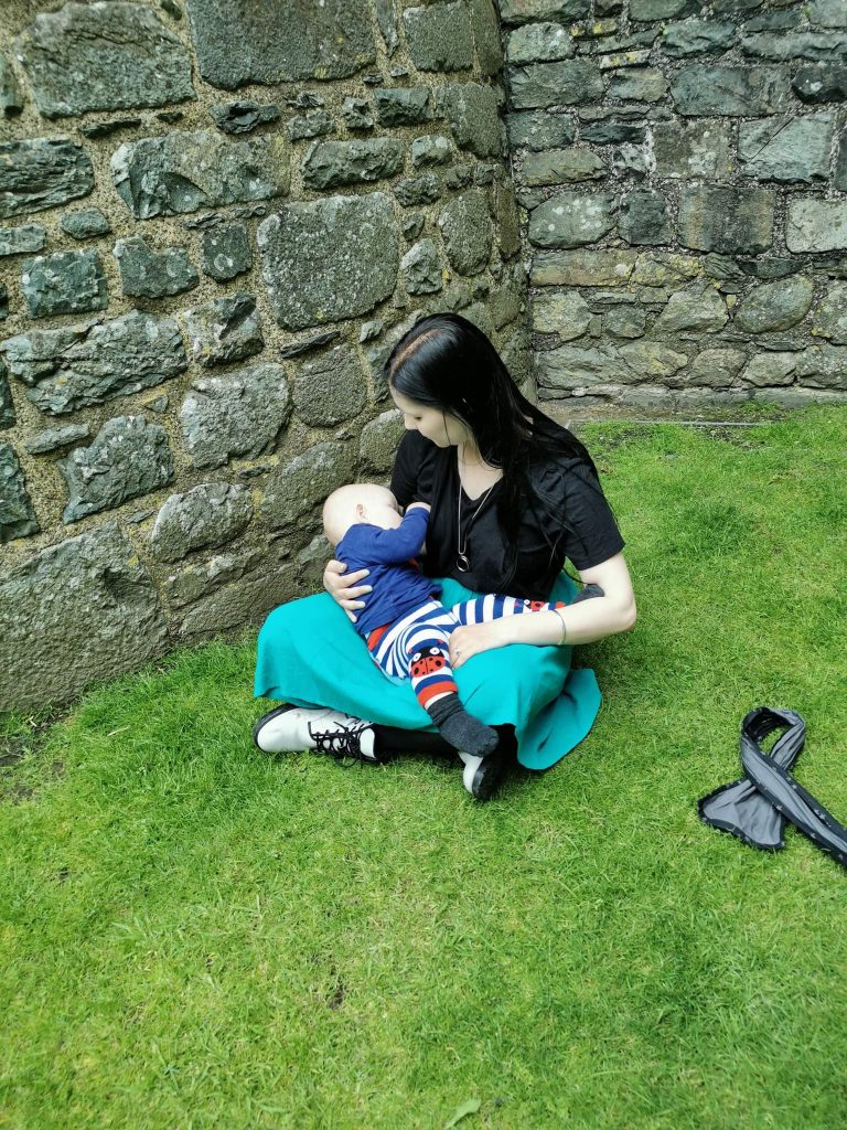 breastfeeding by a castle