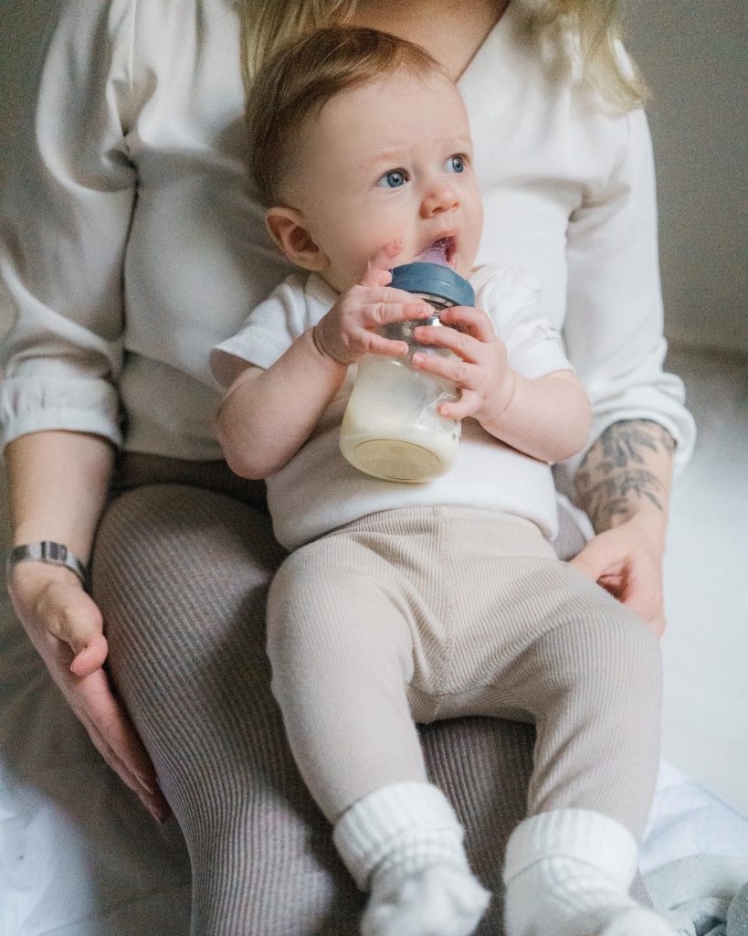 Baby holding Lola&Lykke bottle