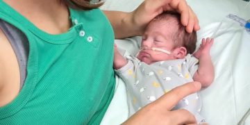 Jo with her premature son in NICU