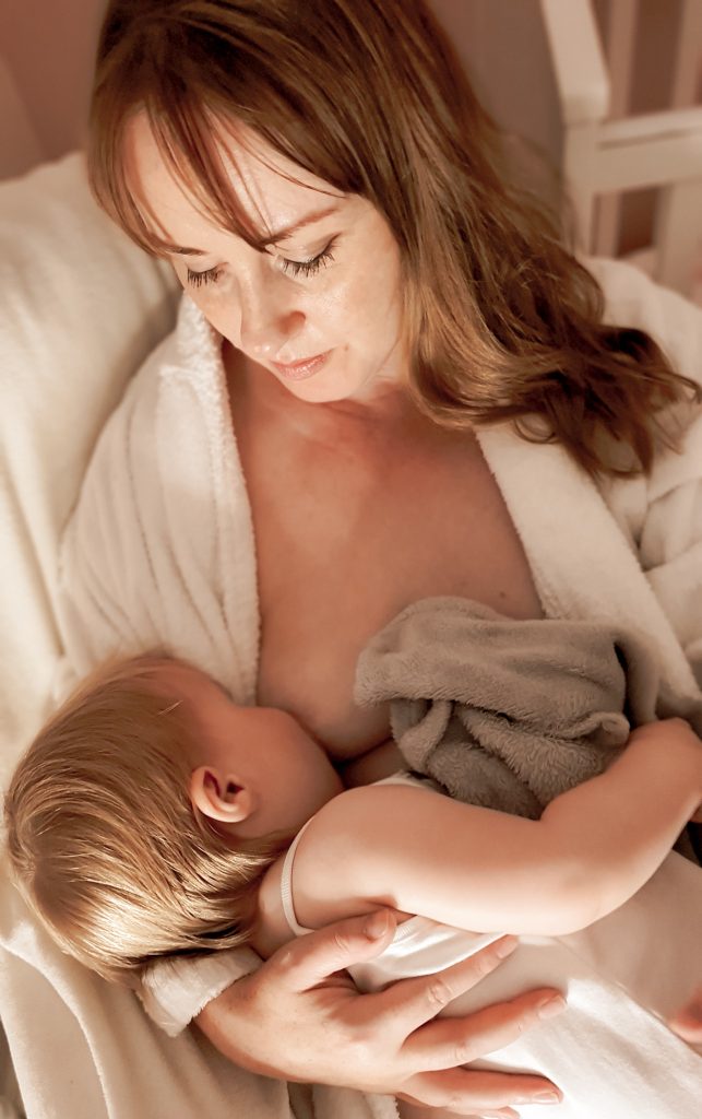 Victoria breastfeeding her toddler