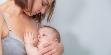 Portrait of a mother who is breastfeeding her baby