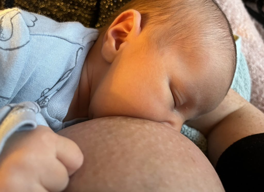 Gemma Orchard breastfeeding son