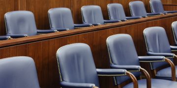 Empty Jury Seats in Courtroom