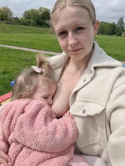 Breastfeeding outdoors in the park