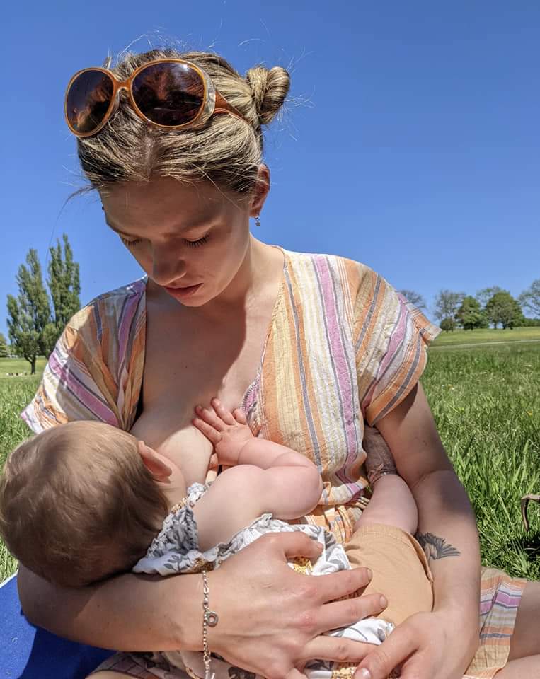 Breastfeeding mother Charlotte breastfeeding baby daughter in public