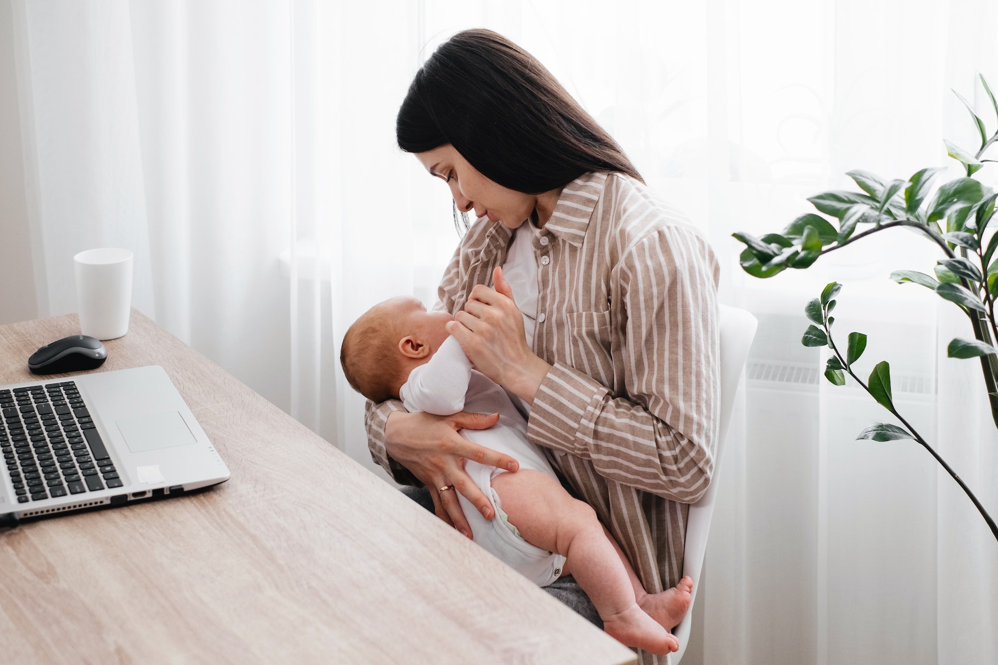 Mother by laptop - a call for breastfeeding support in workplaces