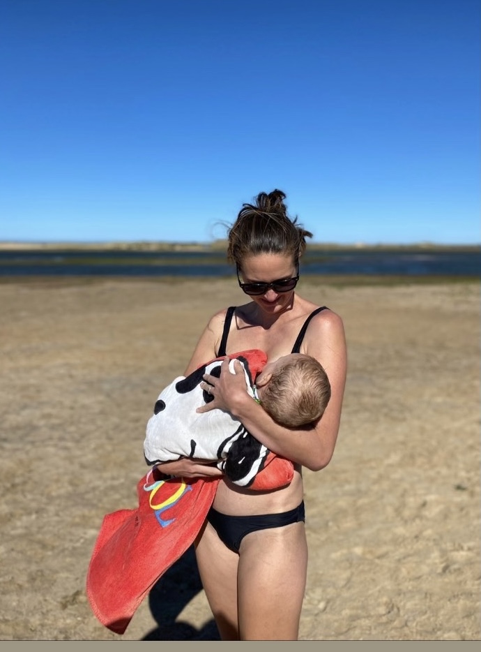 Fiona breastfeeding on a beach in Norfolk