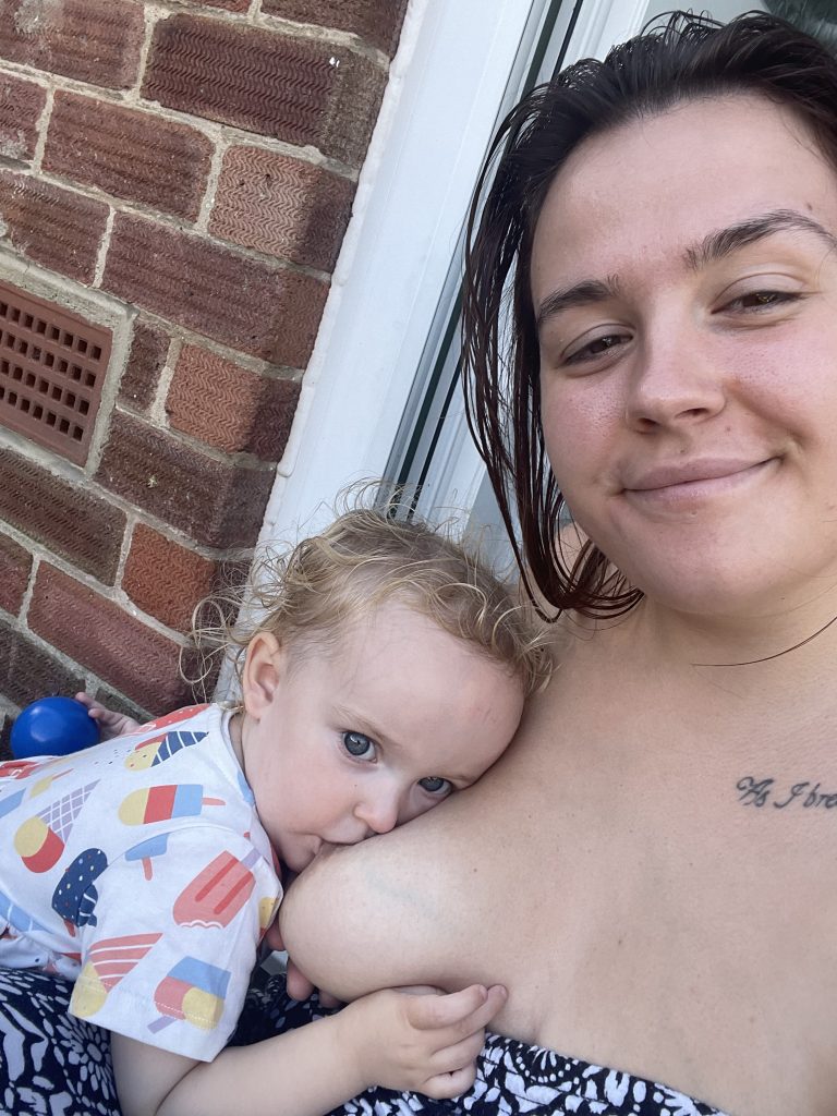 Natalie breastfeeding her toddler