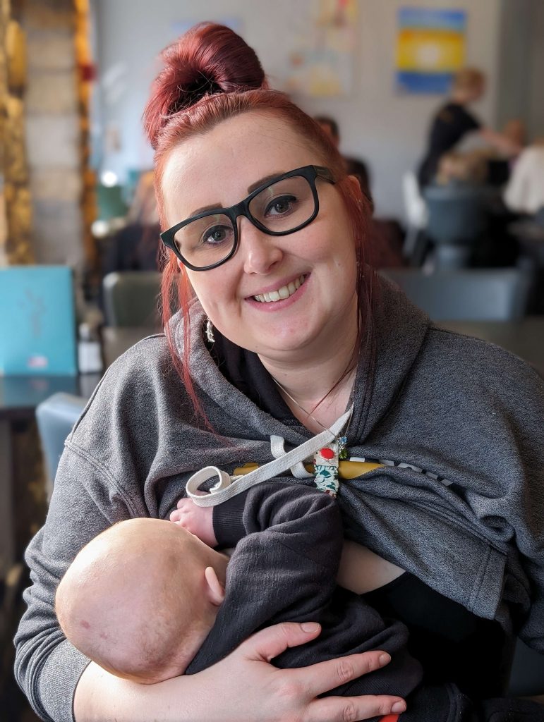 Samantha breastfeeding her baby in public