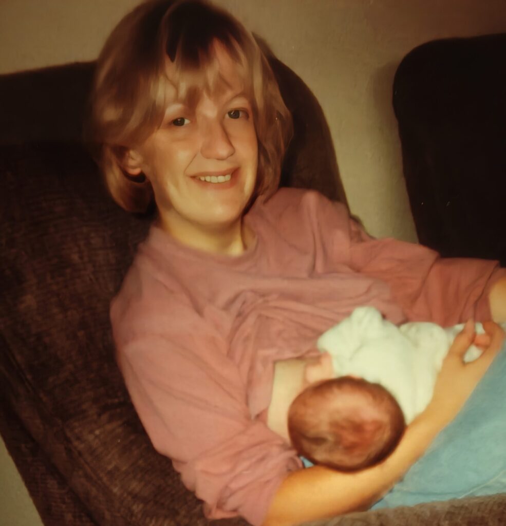 Kiana Van Kempen's mother breastfeeding in the 1990s