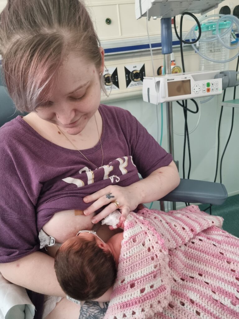 Sophie breastfeeding her baby in hospital