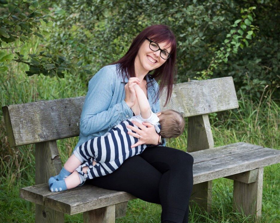 Breastfeeding on a park bench