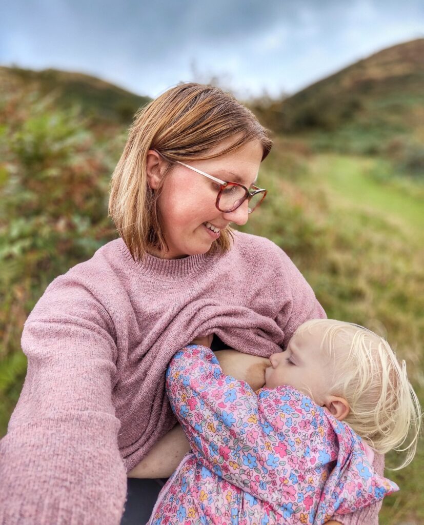 Kiana Van Kempen breastfeeding daughter in countryside