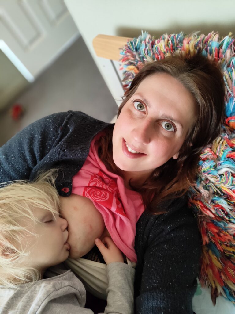 Kiana breastfeeding her toddler daughter