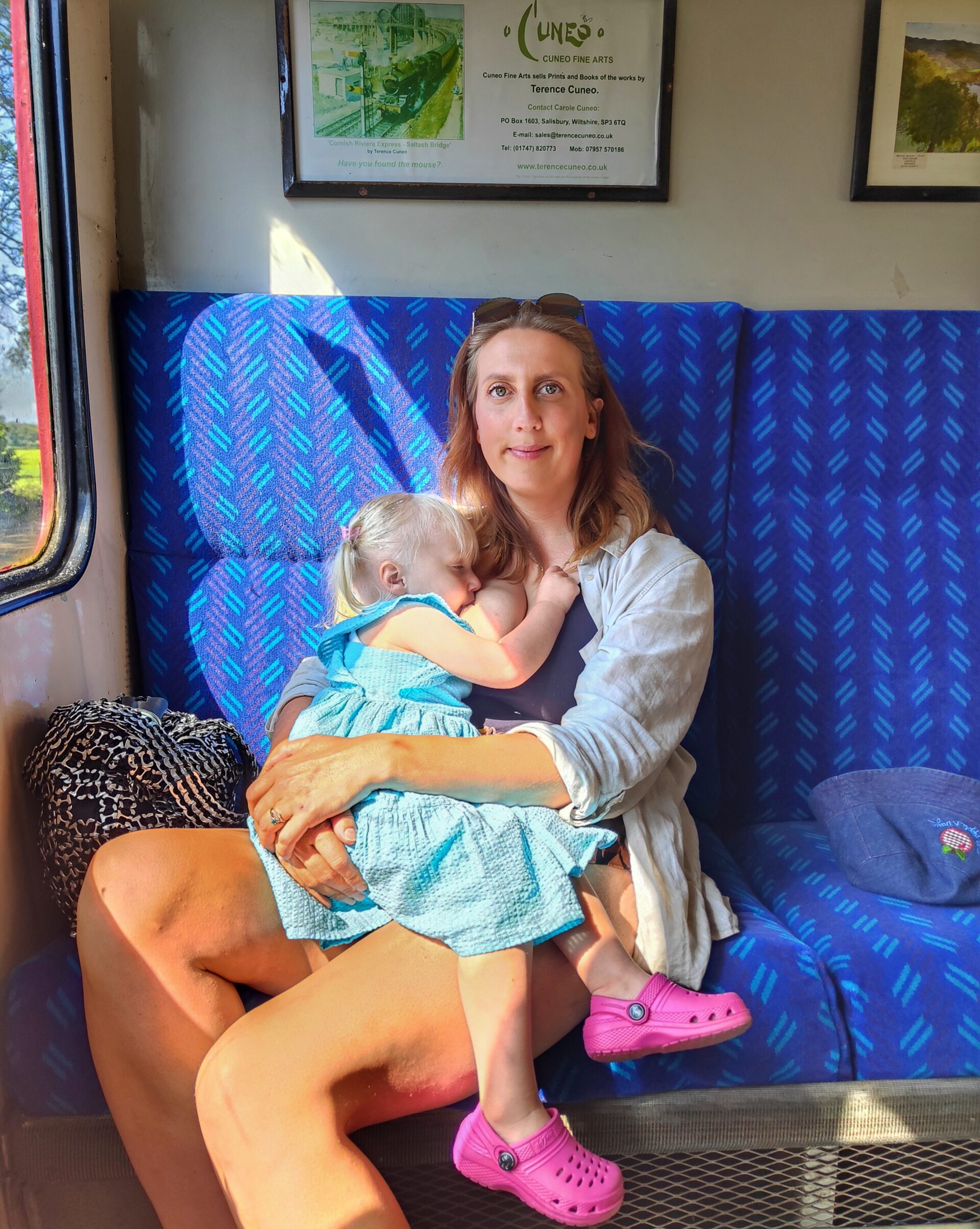 Kiana breastfeeding toddler daughter
