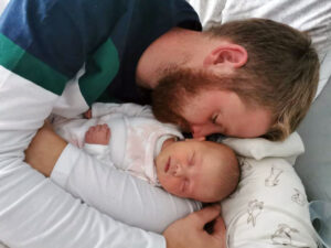 April Robson's partner with baby daughter