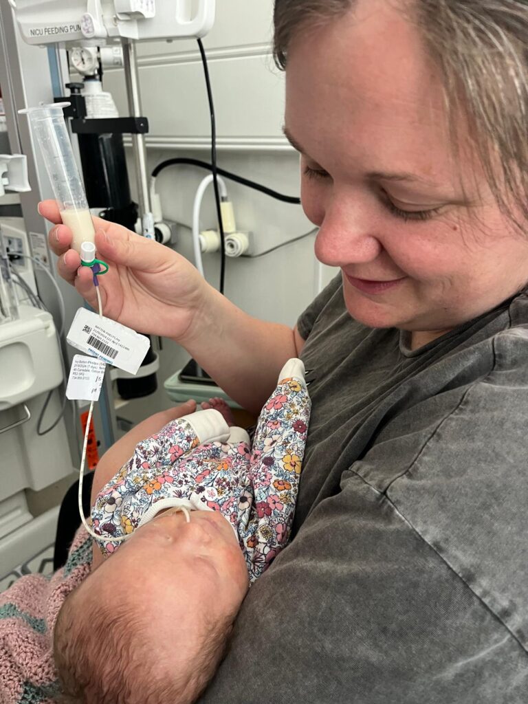 Mum tube feeding baby Ivy with down syndrome