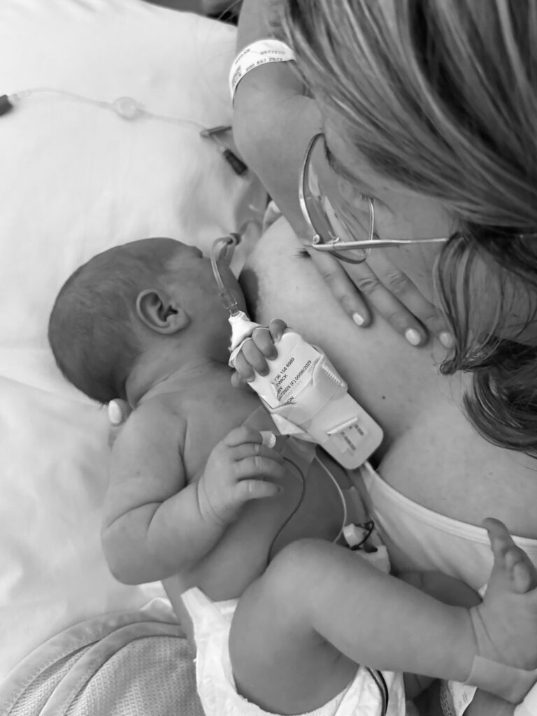 Megan breastfeeding newborn baby in NICU