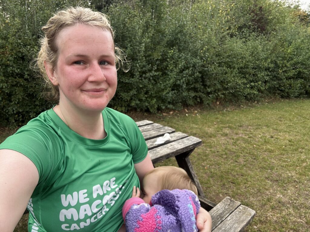 Terri breastfeeding her toddler daughter after a run