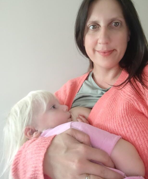 Breastfeeding mother celebrating 1000 days of breastfeeding toddler