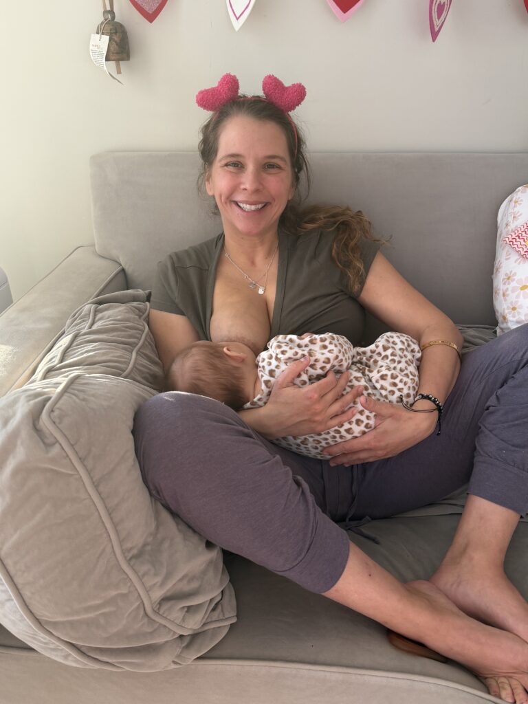 Jessica from Kind Mom breastfeeding her rainbow baby