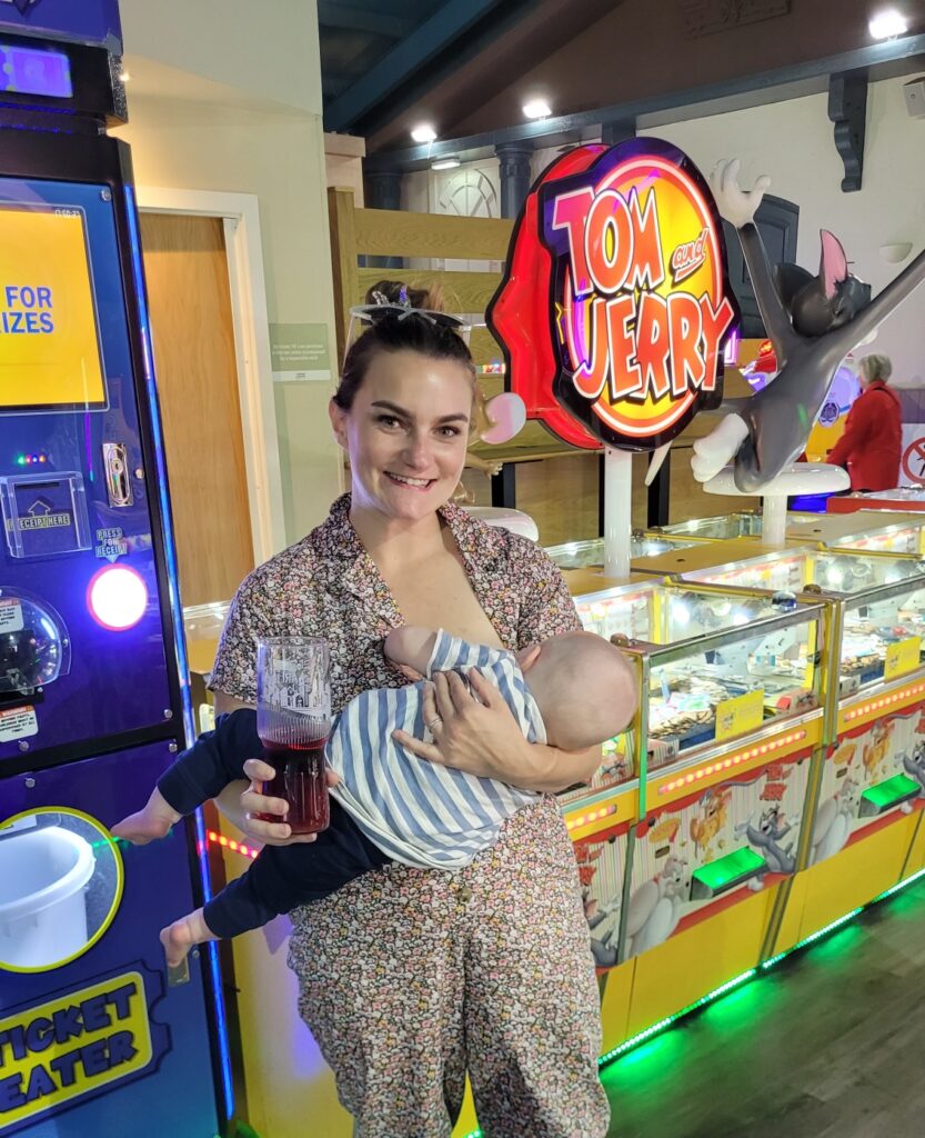 Grace Redmond breastfeeding in public, in an arcade