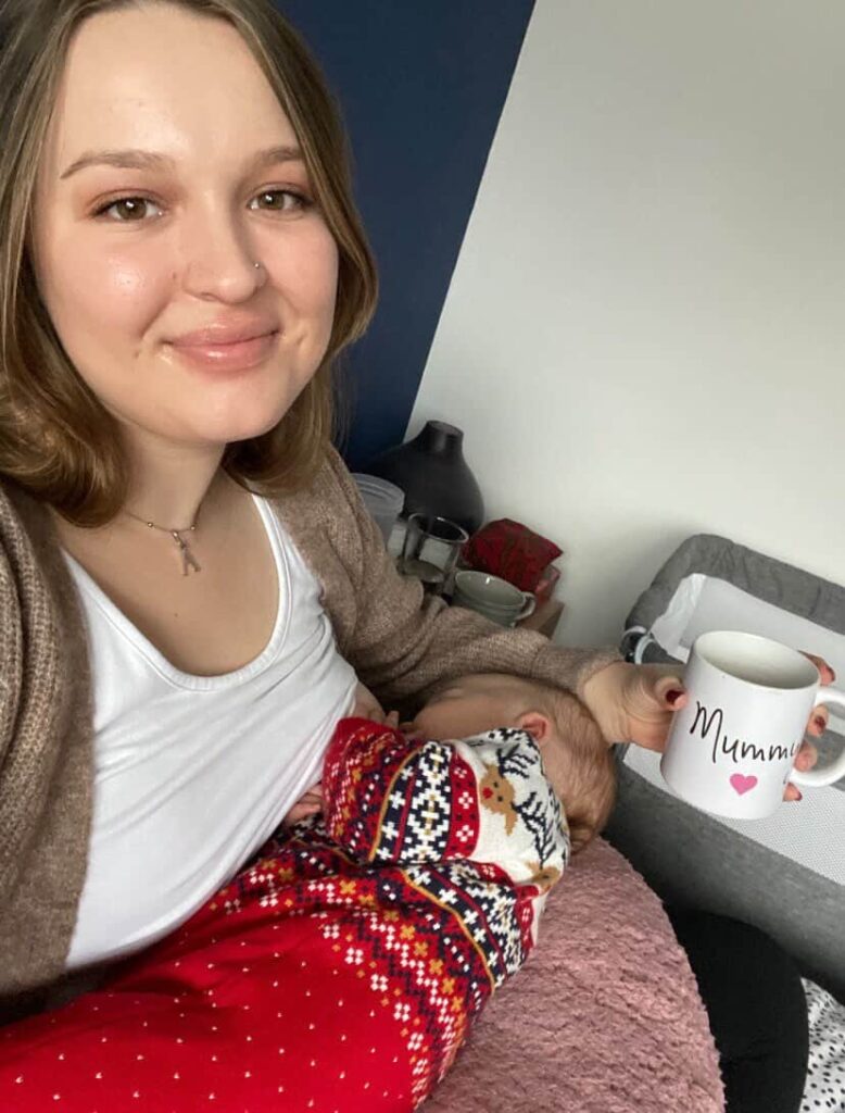 Rachel breastfeeding indoors